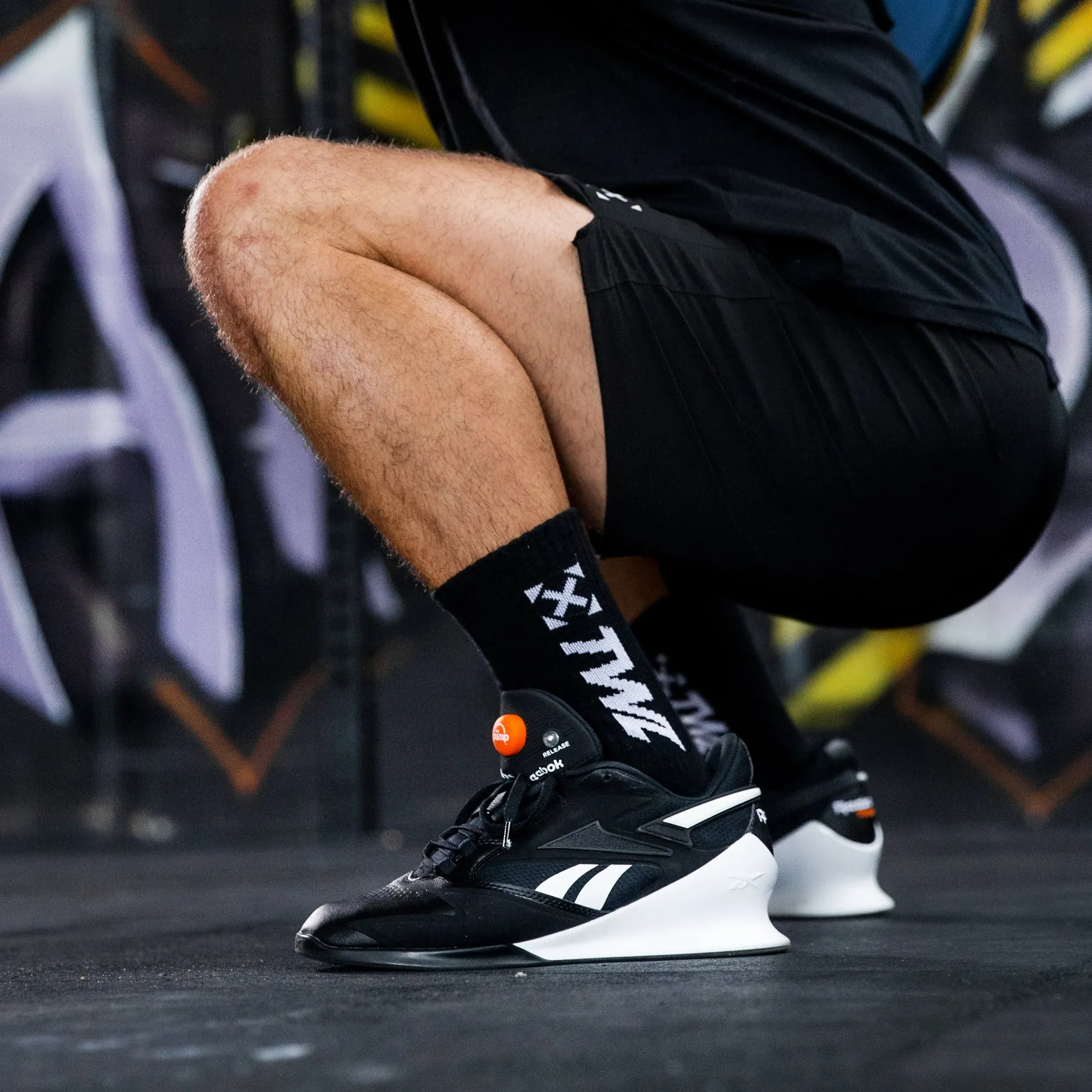 REEBOK - LEGACY LIFTER III - CORE BLACK/FTWR WHITE/SMASH ORANGE